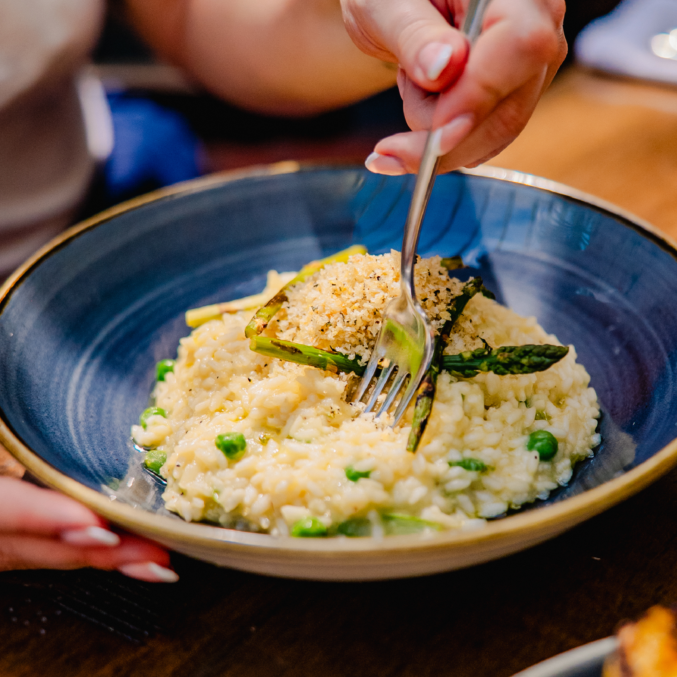 Asparagus Risotto Asparagus Risotto with peas & Pembrokeshire Gold lemon infused rapeseed oil. Topped with a minted breadcrumb gratin.