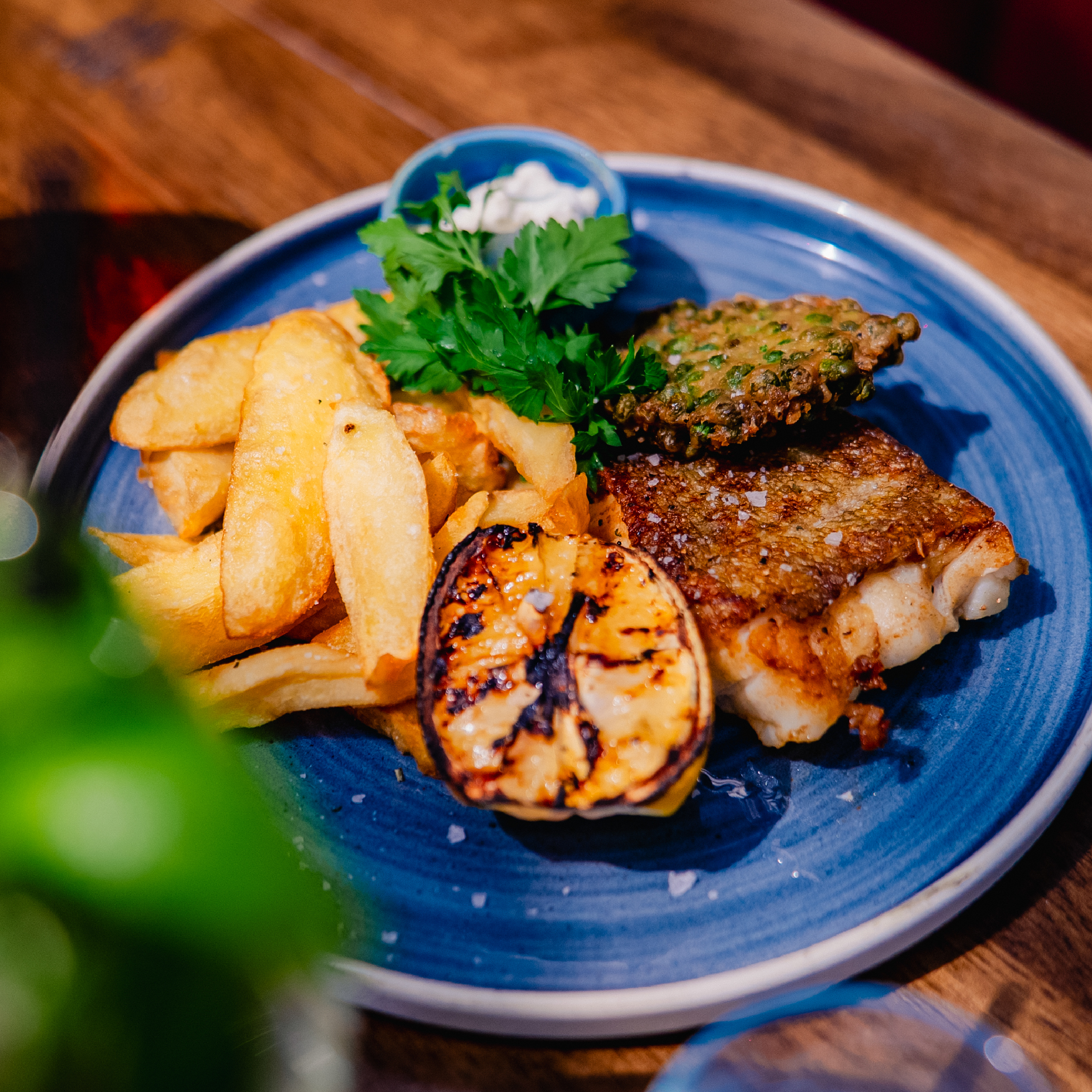 Baked Cod & Chips Baked cod fillet with a battered pea fritter, our famous triple-cooked chips & laverbread tartare sauce.