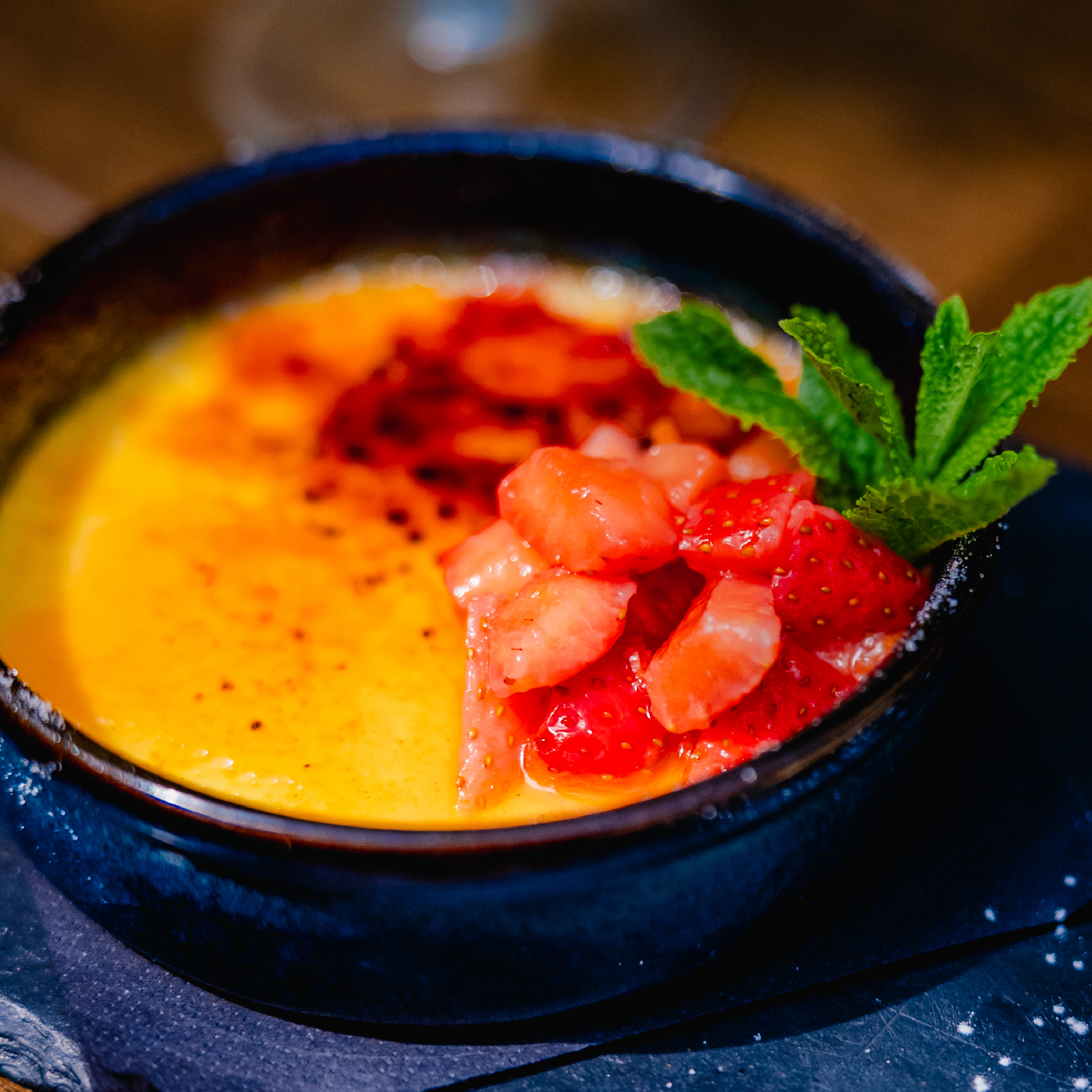 Hensol Castle Strawberry Gin Brûlée Hensol Castle Strawberry Gin Brûlée. Served with macerated strawberries and an Aberffraw shortbread biscuit.