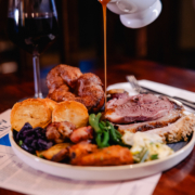 Roast Welsh Sirloin of Beef Cuts of succulent slow-roasted Welsh beef. Served with a Yorkshire pudding. Served family style, with crispy duck fat roast potatoes, baked leek gratin with Caws Teifi oak smoked cheese, seasonal vegetables & bottomless gravy.