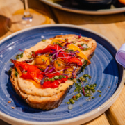 Roasted Pepper Bruschetta Roasted Pepper Bruschetta with cannellini bean purée & chimichurri on toasted sourdough.