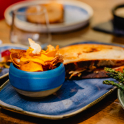 The Hot Welsh Cuban The Hot Welsh Cuban. Pulled pork, Carmarthen ham, pickled gherkins, mustard + Welsh rarebit. Choose from Alex Gooch organic rustic white or seeded malthouse sourdough. Served with our handmade vegetable crisps (or triple-cooked chips +3.00)